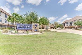 Sign for vine + vail townhomes & apartments